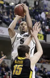 Adreian Payne shoots over Iowa forward Zach McCabe. Payne scored a career-high 16 points and added seven rebounds.