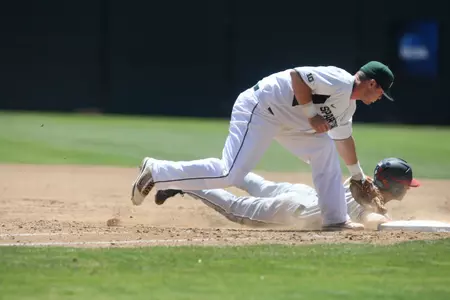 Ryan Krill tags out Jake Alvarez at first base in the third inning of MSU's 8-2 loss to Fresno State on Saturday at Stanford's Sunken Diamond.