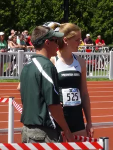 Senior Becca Buchholtz with Assistant Coach Chris Bostwick at the 2012 Big Ten Outdoor Championships.