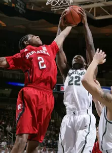 Branden Dawson reaches for a rebound against Nebraska.