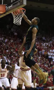 Adreian Payne dunks against Indiana's Christian Watford.