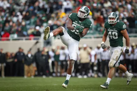 Shilique Calhoun celebrates after recording a 9-yard sack against Purdue.