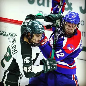 Jake Chelios battles in front of the net during MSU's loss to UMass-Lowell.