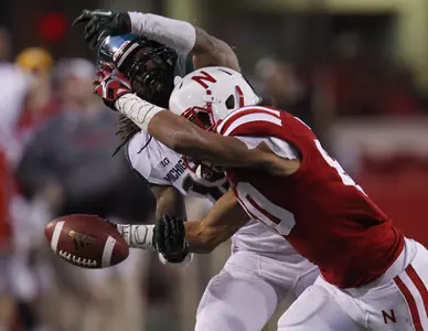 Trae Waynes breaks up a pass against Kenny Bell on Saturday at Memorial Stadium.