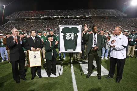 Gene Washington waves to Spartan fans after his name was added to the Spartan Stadium Ring of Fame in 2011.