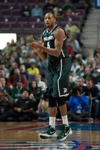 Adreian Payne (5) cheers his teammates on during the first half