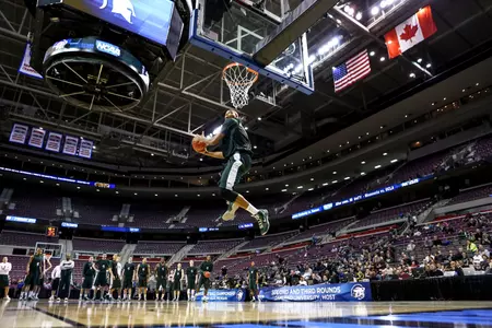 Adreian Payne leaps for a dunk during MSU's practice at The Palace on Wednesday.