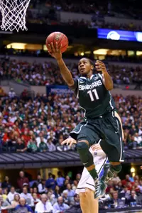 Keith Appling drives the lane against Duke on Friday night at Lucas Oil Stadium.