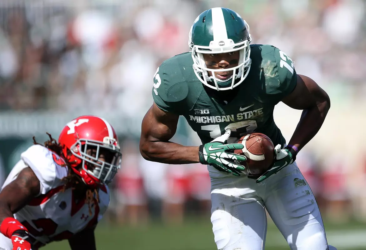 Wide receiver Bennie Fowler runs the ball after a catch in the first half.