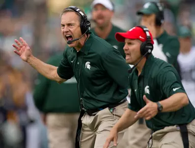 Mark Dantonio yells to his team from the sideline.