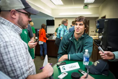 Jake Chelios answers questions during media day.
