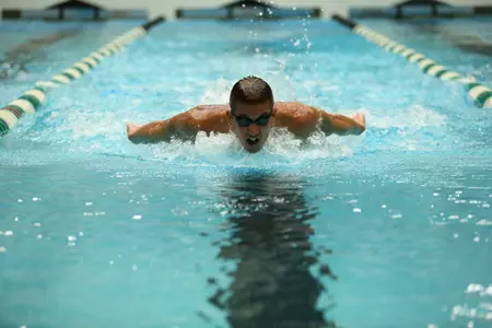 Bryan Williams led the Spartans with wins in the 100 and 200 butterfly.