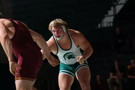 Mike McClure improved to 20-4 on the season with his third-straight Big Ten win on Friday night at Jenison Field House..