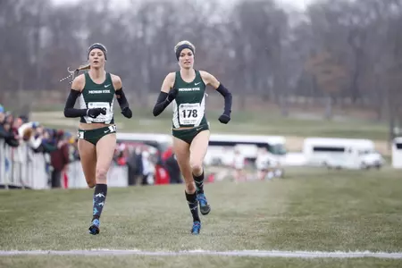 Leah O'Connor and Rachele Schulist run towards the finish line at Friday's NCAA Great Lakes Regional. (Photo by David Stluka, Univeristy of Wisconsin Athletics)
