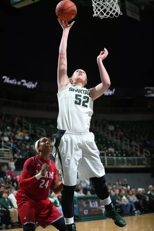 Senior forward Becca Mills tied a career-high with a game-best 22 points to lead No. 19/21 Michigan State to a 90-38 rout at Loyola Chicago Sunday afternoon.