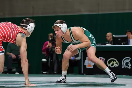 Nick Trimble won his first-round match at the Big Ten Championships over eighth-seeded Brandon Nelsen of Purdue.