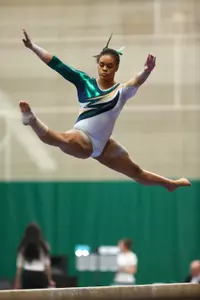 Junior Alina Cartwright earned a win on vault, beam and the all-around in the Spartans' win.
