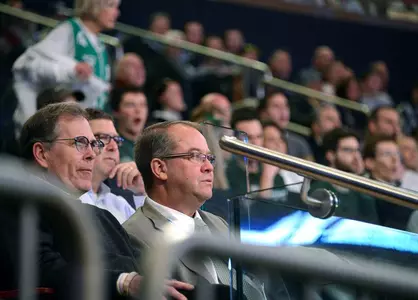 Nike executive Kit Morris and Mark Hollis watch the MSU-Virginia game at Madison Square Garden.