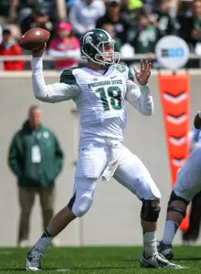 Connor Cook threw for 159 yards and two touchdowns to lead the White past the Green in the spring game, 20-13.