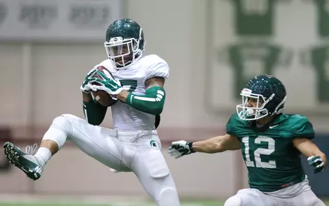 Kurtis Drummond recorded an interception in Friday's first spring scrimmage, but the offense came away with the victory, 27-25.