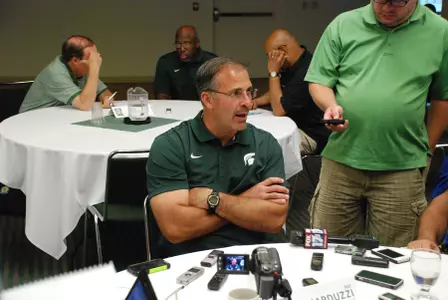 Assistant head coach/defensive coordinator Pat Narduzzi talks to reporters at media day.