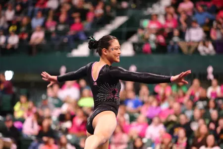 Freshman Anna Gamelo competes on floor