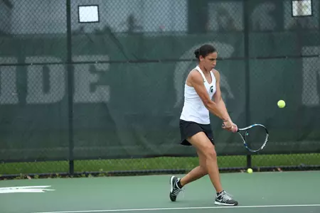 Junior Athena Trouillot stayed on the winning side in her draw, defeating Zoe Douglas of Iowa on Saturday.