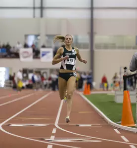 Leah O'Connor crosses the finish line to win the mile on Saturday at the Big Ten Indoor Track & Field Championships. (Photo by Brett Dunbar)