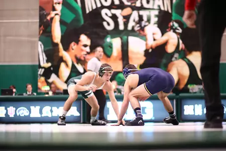 Mitch Rogaliner defeated Maryland's Josh Polack in the first session at the Big Ten Wrestling Championships on Saturday.