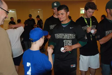 Anthony Cheky chats with one of the Miracle League players.