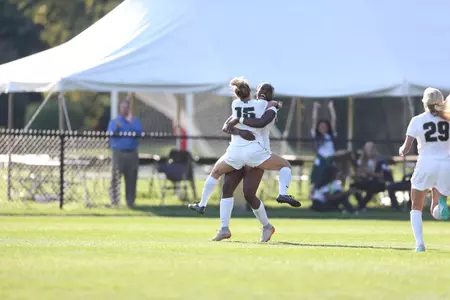 Sophomores Kristelle Yewah and Jamie Cheslik celebrate their goal and assist respectively.