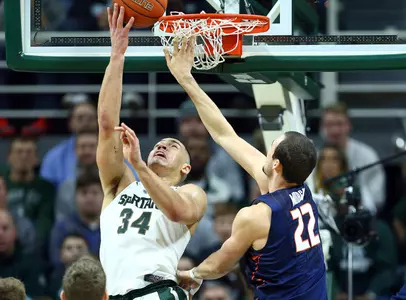 Gavin Schilling shoots the ball against Illinois Fighting Illini center Maverick Morgan.