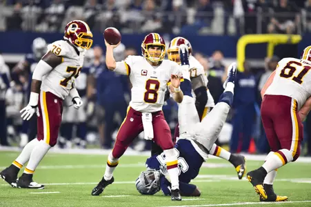 <B><i>Kirk Cousins set franchise single-season records for Washington in passing yards, completions and attempts. (Photo by Garrett Campbell, Washington Redskins)</i></b>.