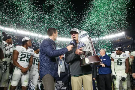 Coach Dantonio Pinstripe Bowl Trophy Celebration.