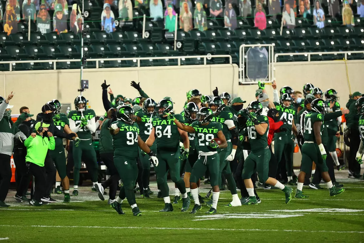 Shakur Brown team celebrate interception vs Northwestern