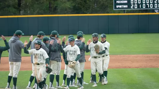 Team high fives celebration vs Michigan