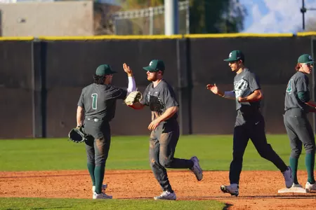 Team high fives celebration at UNLV 2022