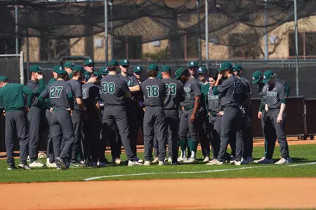 Team huddle and Coach Boss at UNLV 2022