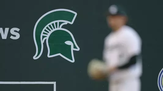 Spartan head blurred baseball player at Greenville