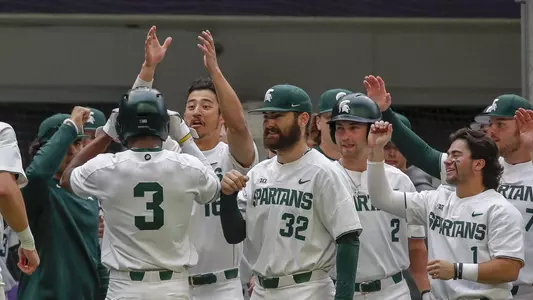 Zaid Walker, dugout celebration vs Kansas Cambria Classic