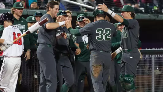 Zach Iverson, team celebration Lugnuts Crosstown Showdown 2022