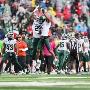 Khris Bogle and Jaden Mangham jump celebrate interception at Rutgers