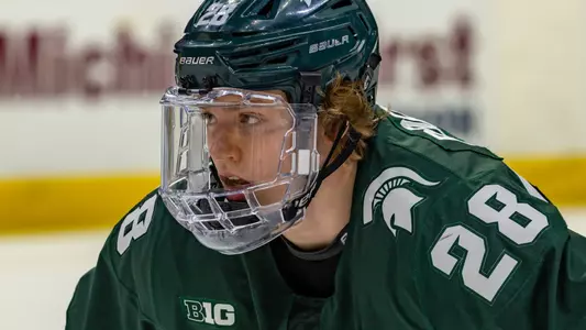DETROIT, MI - FEBRUARY 11: Karsen Dorwart #28 of the Michigan State Spartans gets set for the face-off against the Michigan Wolverines during the first period of an NCAA MenÕs college hockey Dual in the D game at Little Caesars Arena on February 11, 2023 in Detroit, Michigan.The Wolverines defeated the Spartans 4-3 in O.T. (Photo by Dave Reginek/Getty Images) *** Local Caption *** Karsen Dorwart