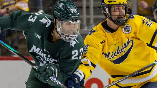 DETROIT, MI - FEBRUARY 11: Jagger Joshua #23 of the Michigan State battles for position with Steven Holtz #24 of the Michigan Wolverines during the second period of an NCAA MenÕs college hockey Dual in the D game at Little Caesars Arena on February 11, 2023 in Detroit, Michigan. (Photo by Dave Reginek/Getty Images) *** Local Caption *** Jagger Joshua; Steven Holtz