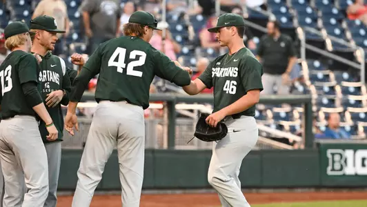 Nick Powers high fives dugout