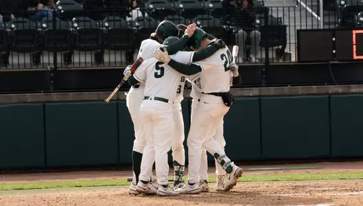 Sam Busch HR huddle at plate