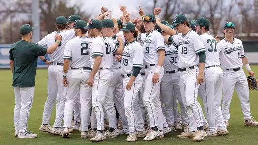 Team huddle at Fluor Field in Greenville