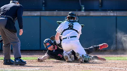 Sam Thompson tagging Rutgers runner out at plate