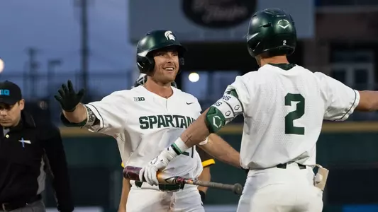 Jack Frank and Dillon Kark celebrate after Frank HR at Jackson Field in Capital Clash vs WMU