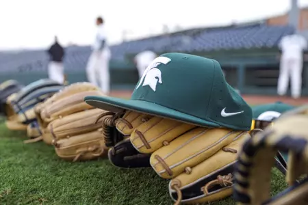 Spartan hat and baseball glove at Greenville
